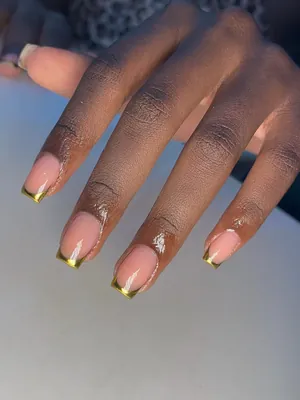 Nude French tip nails with gold lines